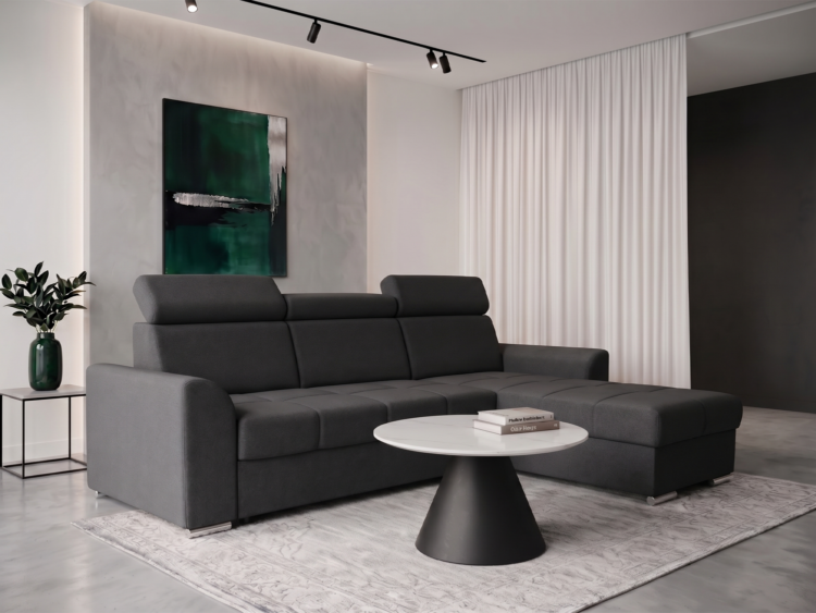Modern living room with a dark gray sectional sofa, round marble coffee table, and a gray rug; abstract green artwork on the wall and a green vase with a plant on a side table to the left.