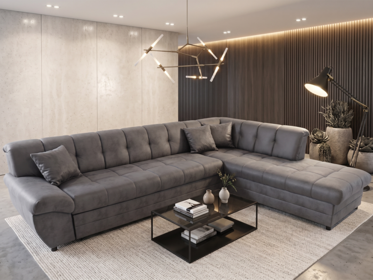 Contemporary living room with a large gray L-shaped sectional sofa, beige rug, and a black glass coffee table with books and vases.