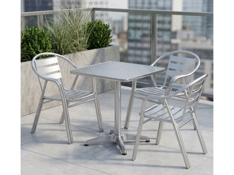 Outdoor metal patio table with four matching aluminum chairs on a tiled balcony, with planters in the background.