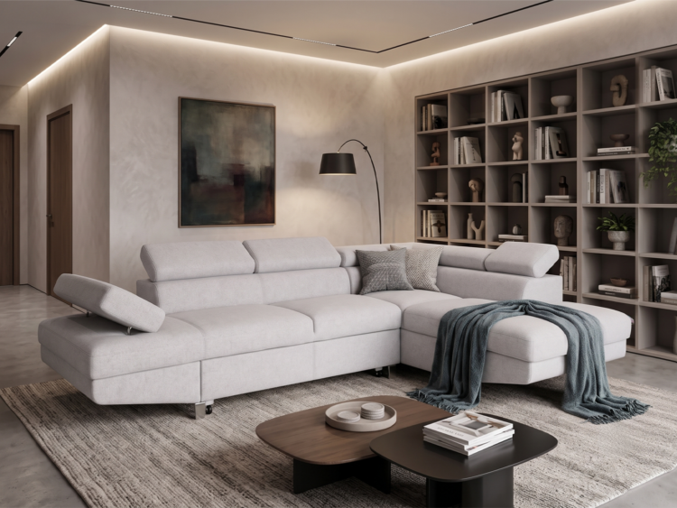 Contemporary living room with a light gray sectional sofa, chaise, and a dark arc floor lamp beside a tall bookshelf wall.
