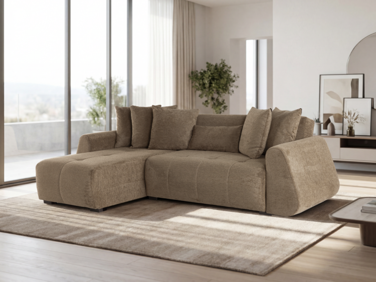 Tan sectional sofa in a bright, modern living room with large windows and a beige rug.