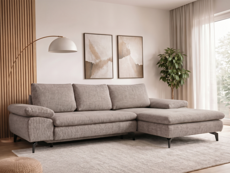L-shaped gray sectional sofa in a bright, modern living room with a wooden slat wall, arc floor lamp, two beige abstract prints, and a potted plant by a sheer-curtained window.
