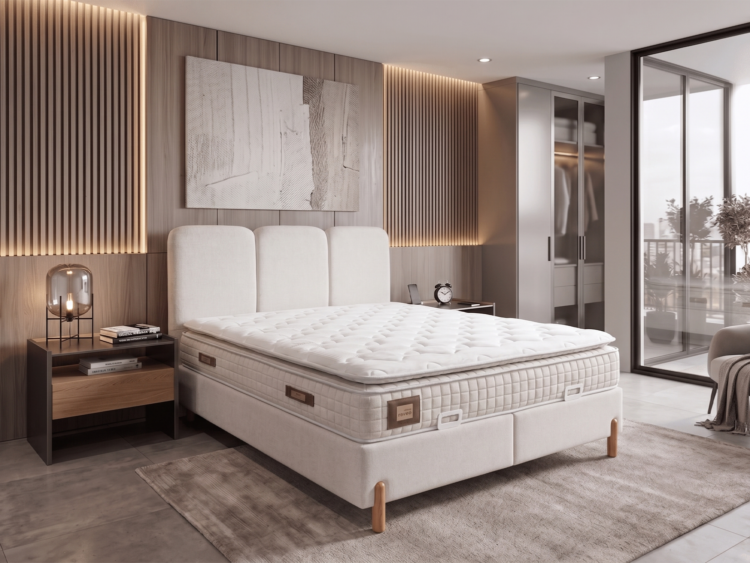 Modern bedroom with a plush white bed, tufted headboard, wooden slat wall, and balcony door.