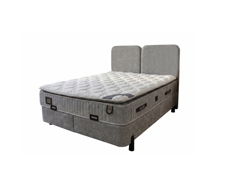 Grey upholstered bed with two tall headboard panels and a thick, quilted mattress on a low-profile frame.