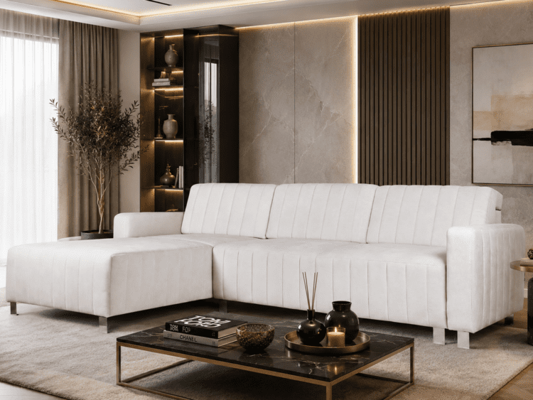 Bright, modern living room with a white L-shaped sofa, marble wall panels, and a glass coffee table.