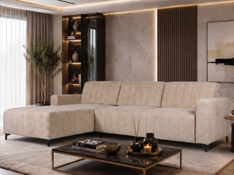 Modern beige sectional sofa in a stylish living room with a glass-front cabinet, plant, and warm ambient lighting behind marble panels