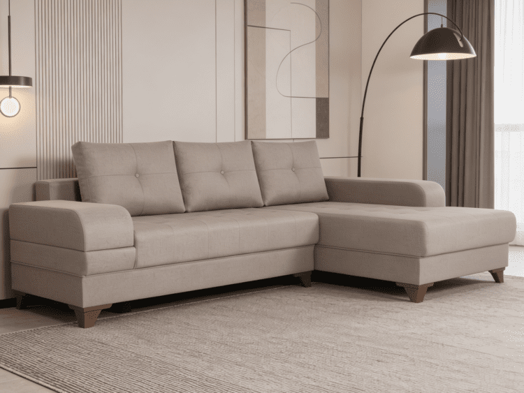 Beige fabric sectional sofa with chaise lounge in a contemporary living room, with matching cushions and a striped rug beneath.