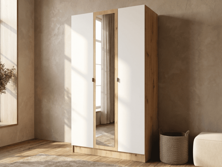 Wooden wardrobe with white doors and a central mirrored panel in a sunlit bedroom.