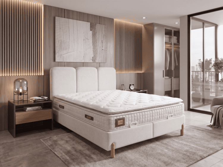 Modern bedroom with a plush white bed, tufted headboard, wooden slat wall, and balcony door.