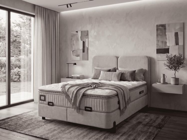 Modern bedroom with a large upholstered bed, two nightstands, abstract wall art, and a sliding glass door to a garden.