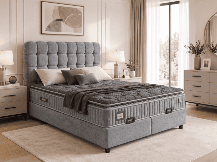 King-size bed with a tall, tufted gray headboard in a serene bedroom with matching nightstands and neutral decor.