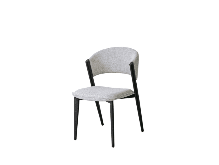 Grey fabric upholstered chair with a curved back and four black angled legs.